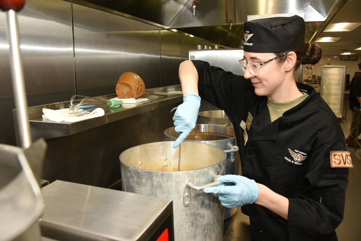 food network candy thermometer calibration in ice bath showing 32 degrees Fahrenheit